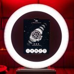 Presto photo booth displaying branded watch advertisement with red lighting