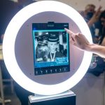 Guest selects options on Presto booth touchscreen with selfie display