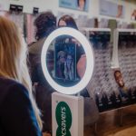 Presto booth used at a Specsavers activation with people in the background