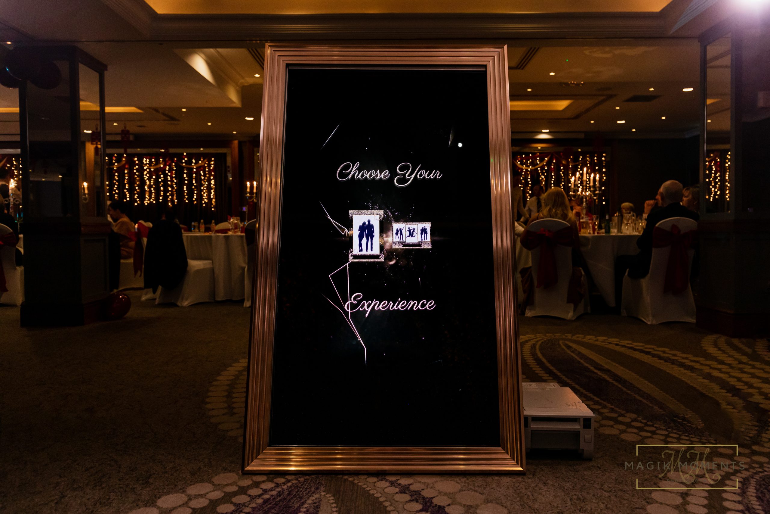 Elegant Magik Mirror Photo Booth in a ballroom setting with “Choose Your Experience” screen