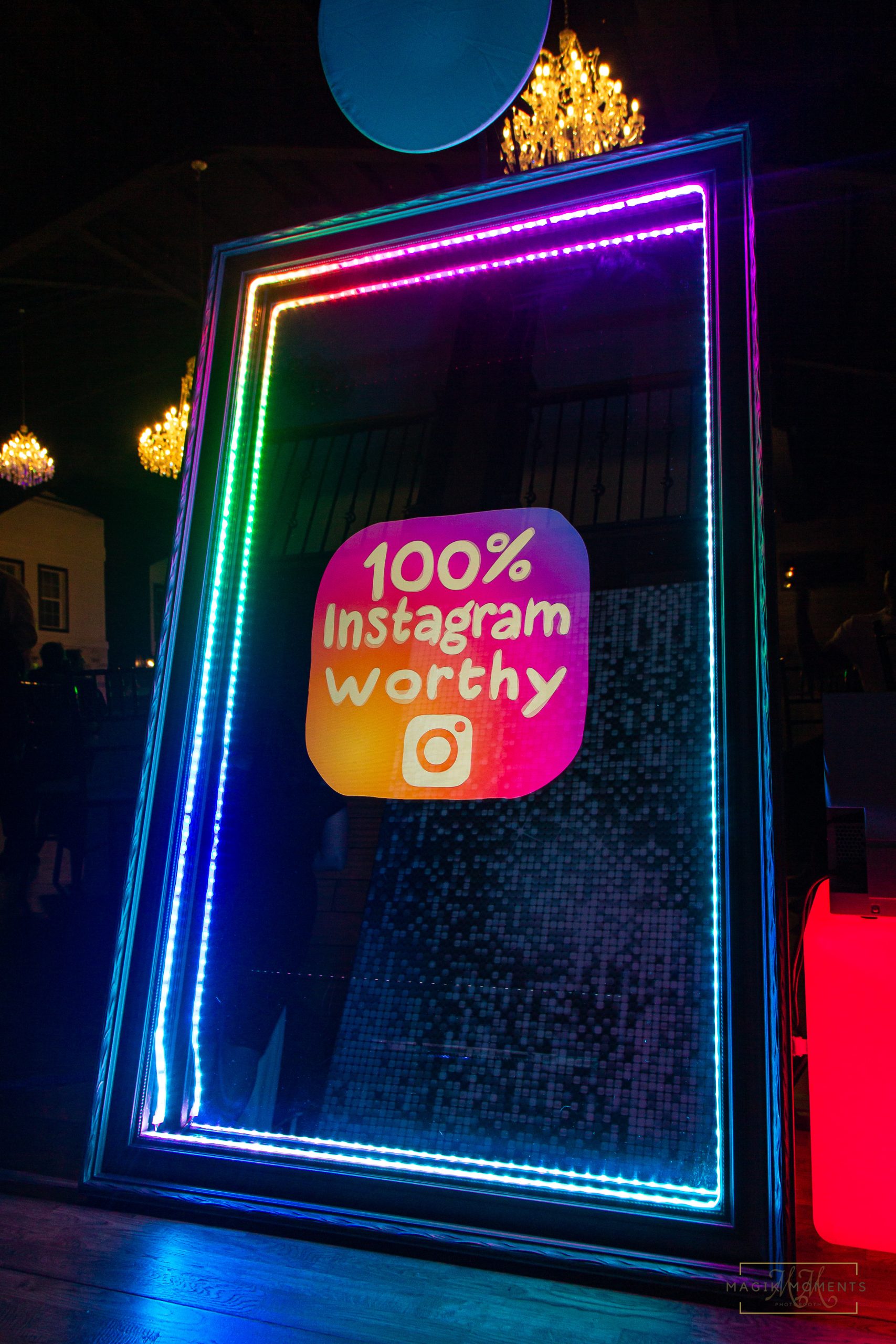 Magik Mirror Photo Booth with rainbow LED lights and “100% Instagram Worthy” display